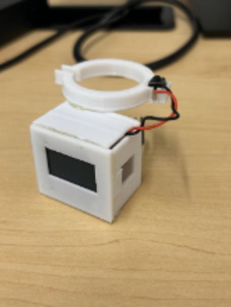 MediGuard Clip, front view: the OLED display showing dose information